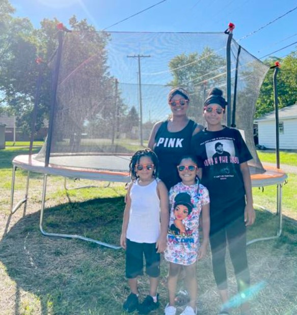 Kim Calhoun and her children’s new favorite hangout: their backyard trampoline.