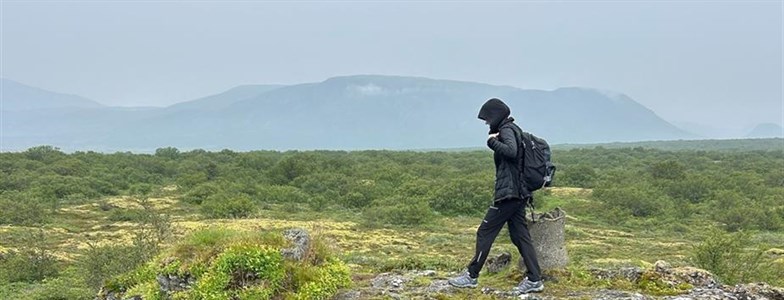 Person hiking across the mountains.